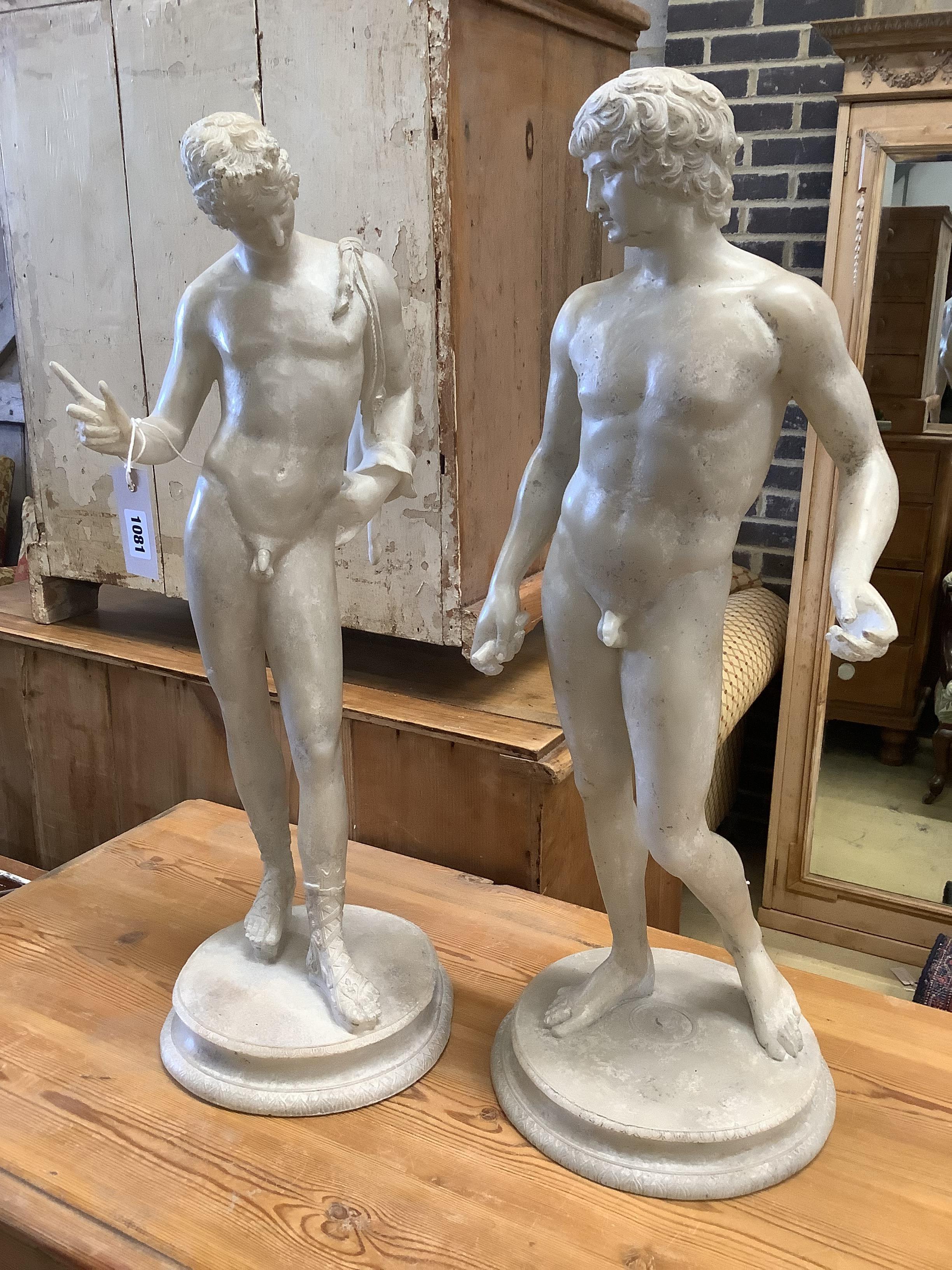 A pair of faux marble classical figures, larger 62cm high